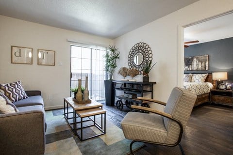 an open living room with a couch and a chair